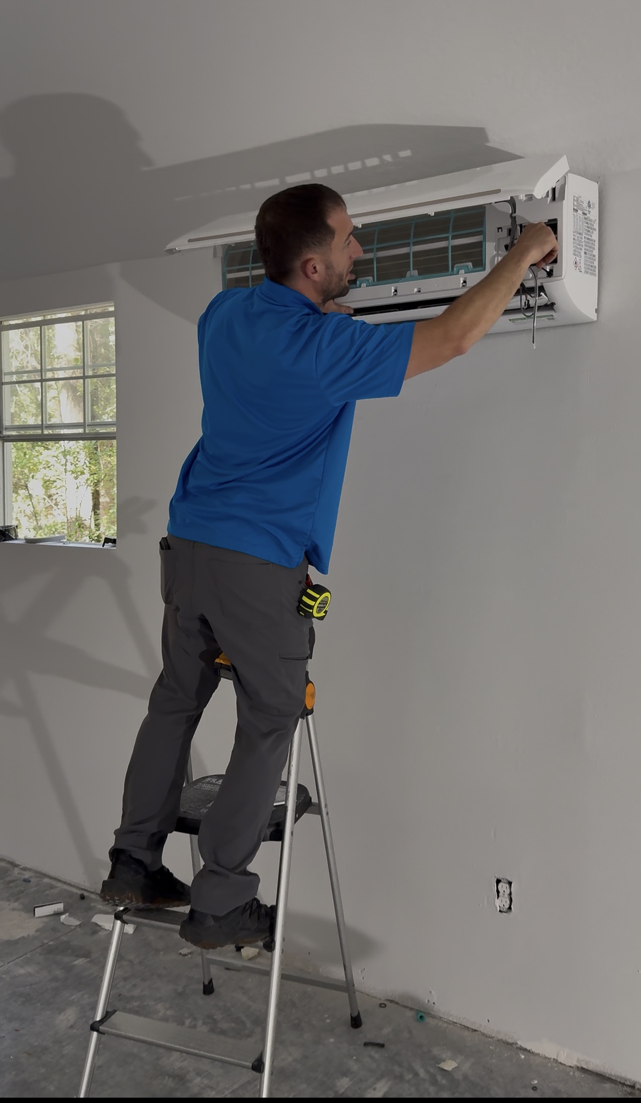 Eagle AC technician installing mini-split HVAC unit